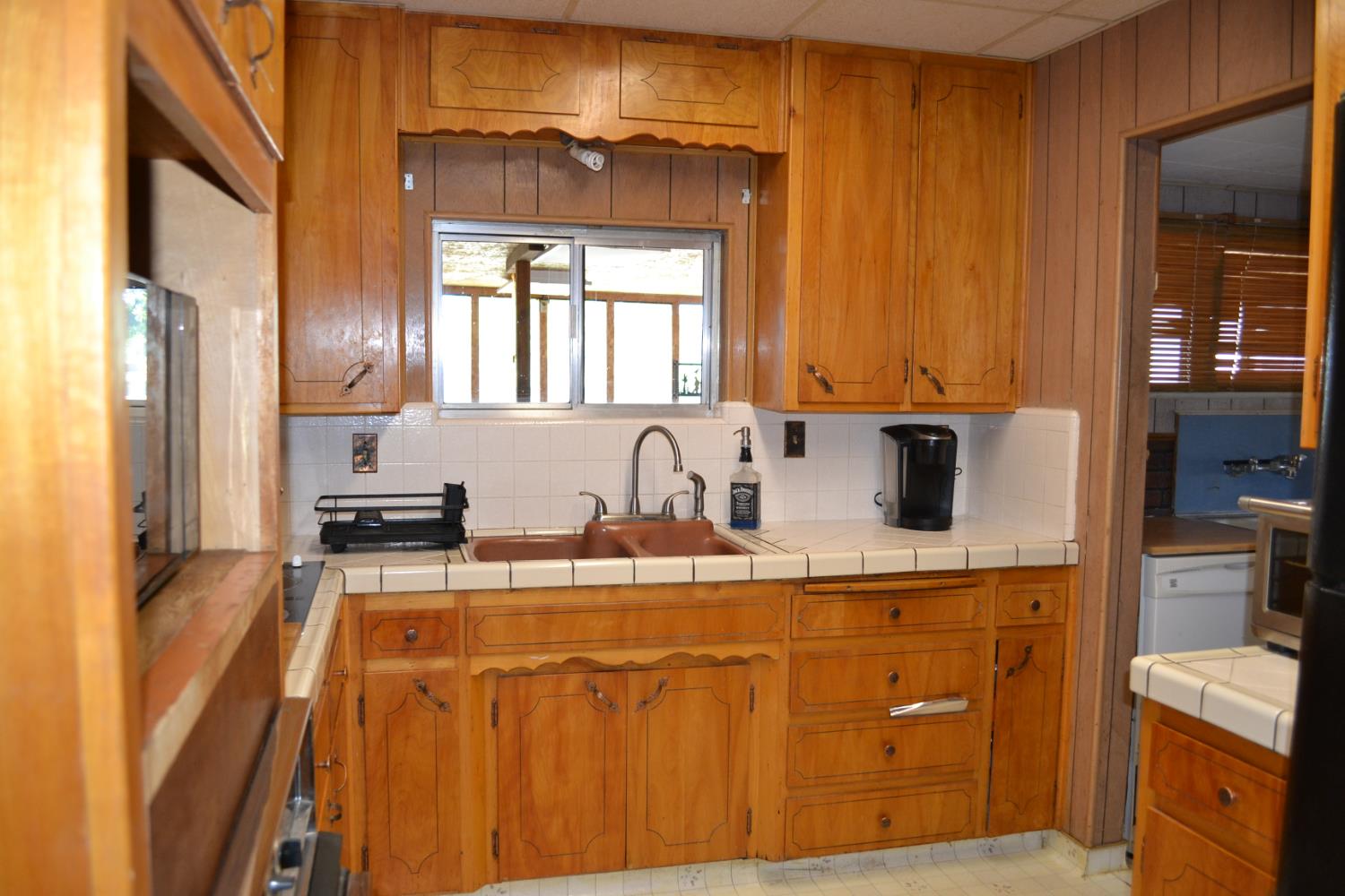 821 Orestimba Road Newman, CA 95360 - Photo 4 of 34 a kitchen with stainless steel appliances granite countertop a sink a stove and a refrigerator