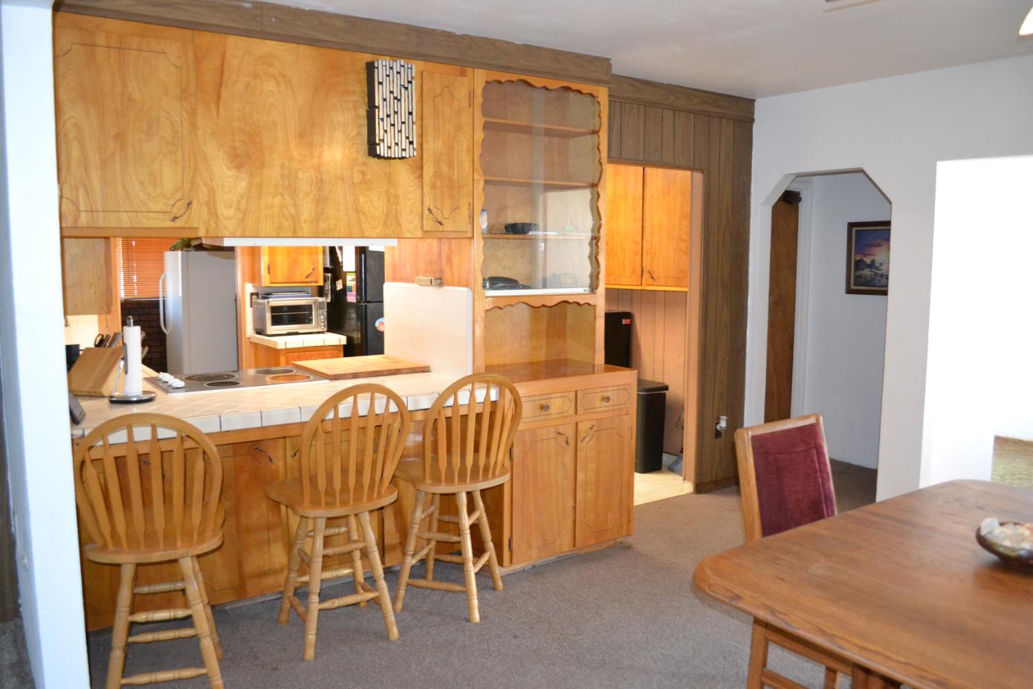 821 Orestimba Road Newman, CA 95360 - Photo 6 of 34 a dining room with furniture and a large window