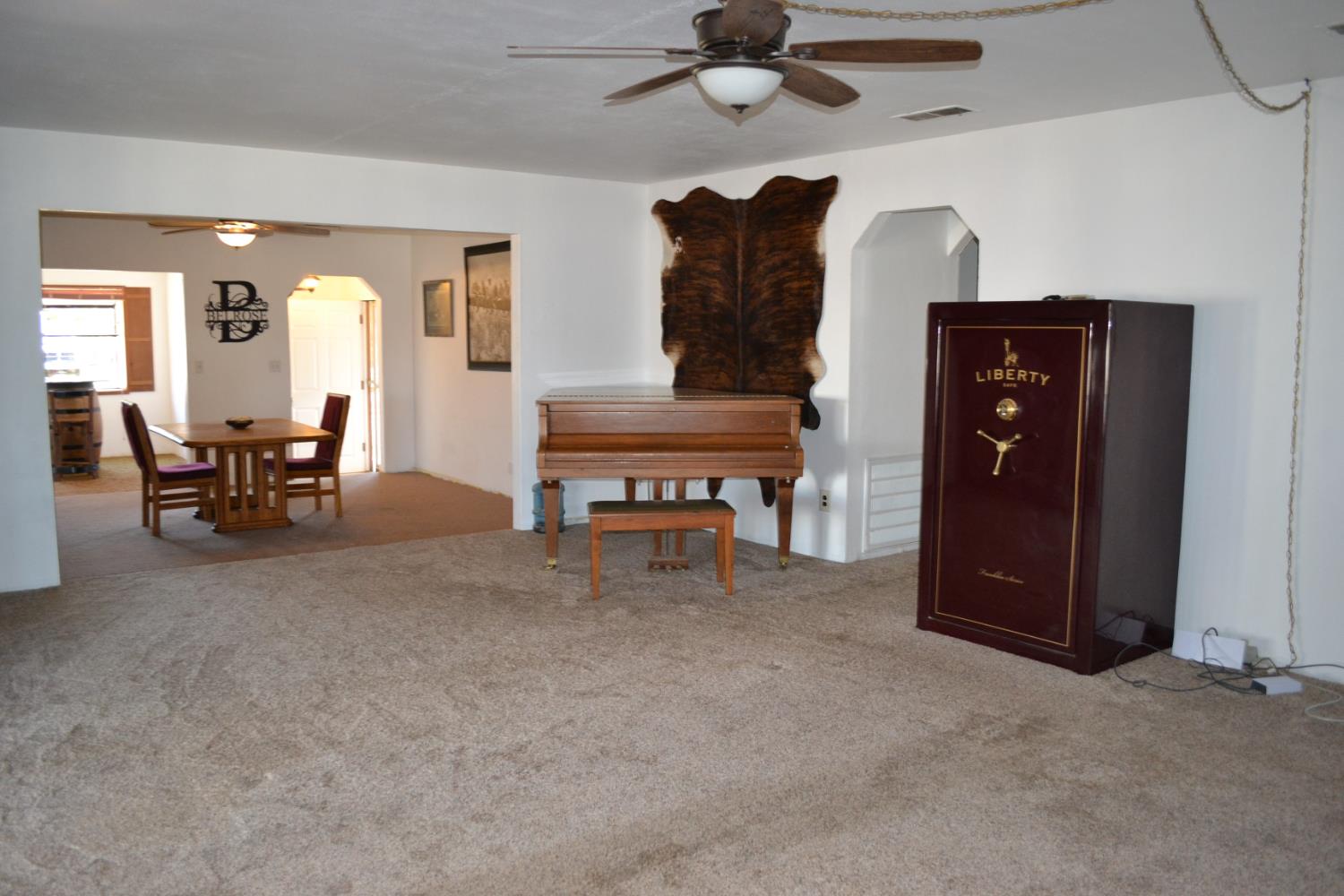 821 Orestimba Road Newman, CA 95360 - Photo 8 of 34 a view of a livingroom with furniture and a ceiling fan