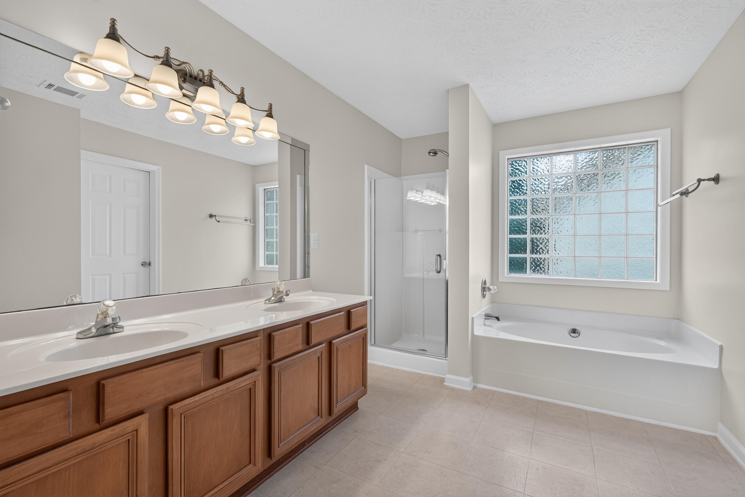 2193 Shaker Run Road Lexington, KY 40509 - Photo 24 of 34 The primary bath is quite large with dedicated vanities and bit closet.