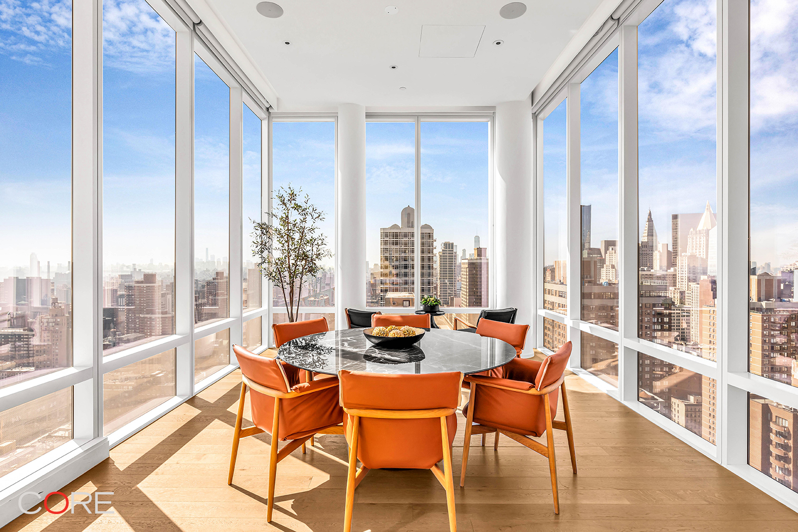 501 3rd Avenue, Unit 20C Manhattan, NY 10016 - Photo 11 of 17 a dining room with furniture a chandelier and wooden floor