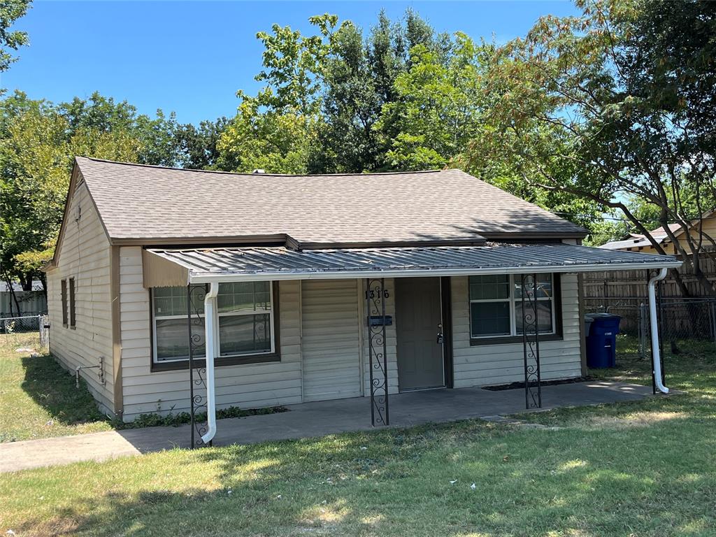 1316 North Prairie Creek Road Dallas, TX 75217 - Photo 2 of 19 Front exterior featuring light-colored siding, a covered porch with decorative metal supports, and a gabled roof
