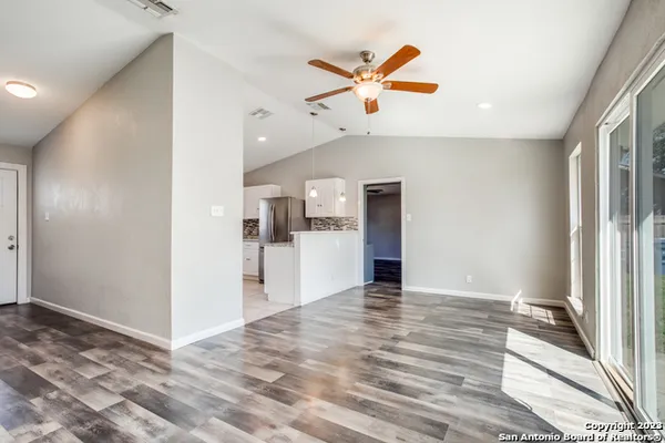 a view of a kitchen with a sink and cabinet with wooden floor