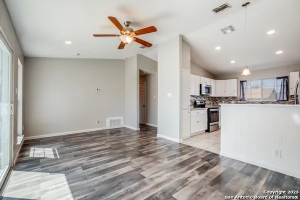 a view of kitchen with wooden floor