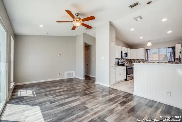 a view of kitchen with wooden floor