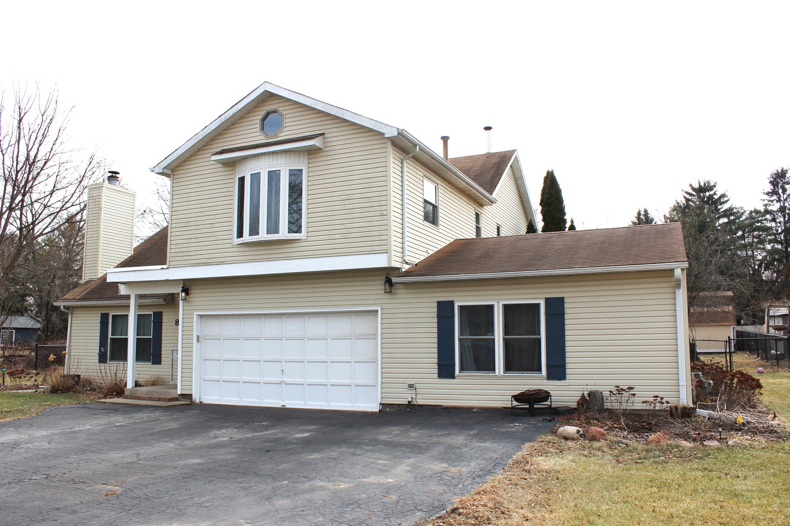 a front view of a house with a garage