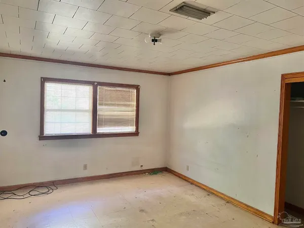 a view of an empty room with a window