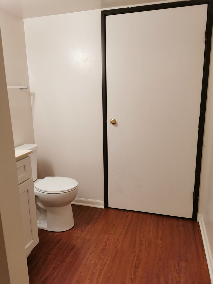 1424 Rock Run Drive, Unit B1 Crest Hill, IL 60403 - Photo 14 of 14 a bathroom with a toilet and a sink