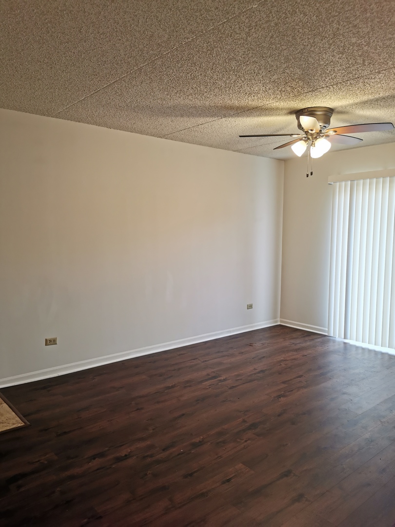 1424 Rock Run Drive, Unit B1 Crest Hill, IL 60403 - Photo 4 of 14 a view of a room with wooden floor