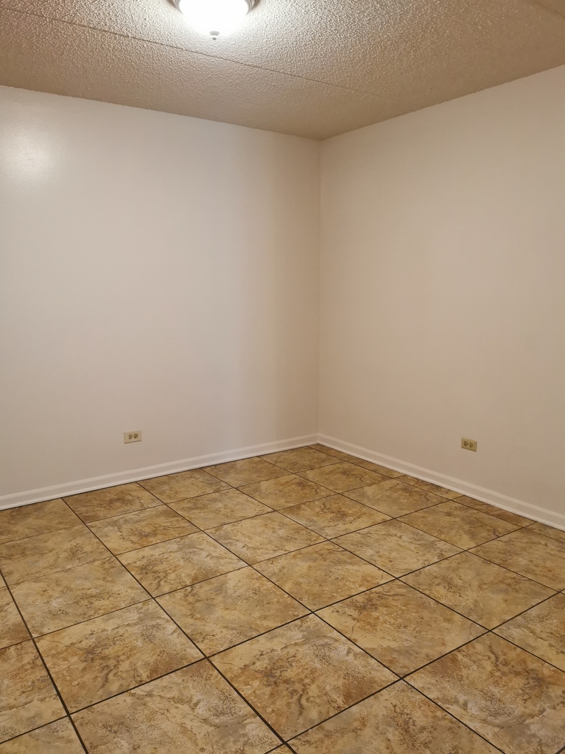 1424 Rock Run Drive, Unit B1 Crest Hill, IL 60403 - Photo 7 of 14 a view of empty room