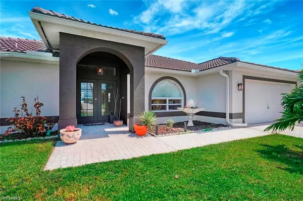 a view of front door with outdoor seating