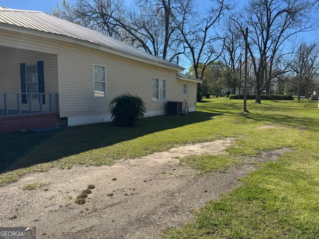 a view of room with window and wooden floor