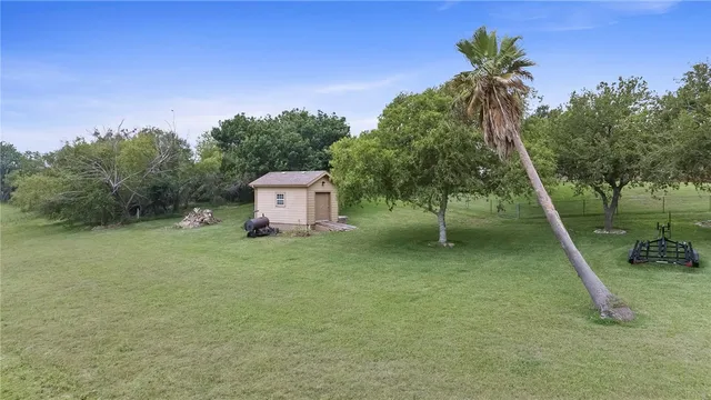 a backyard of a house with lots of green space
