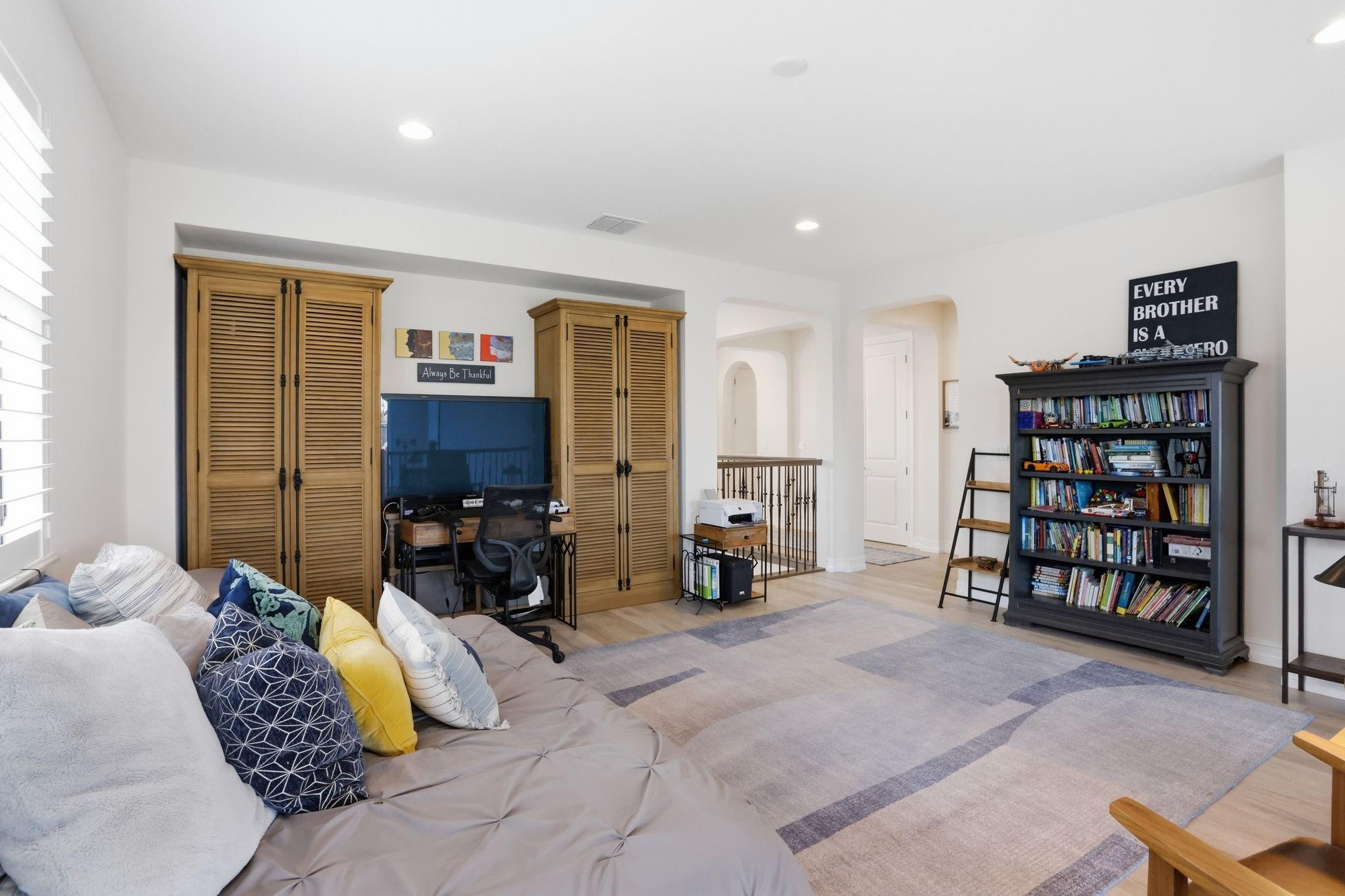 11585 Horizon Road Parkland, FL 33076 - Photo 17 of 91 a bedroom with furniture and a book shelf