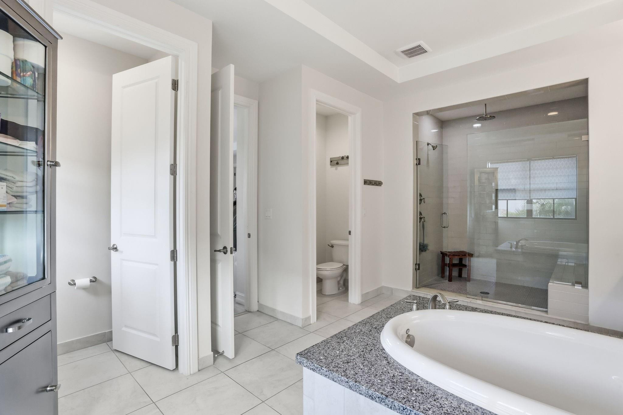 11585 Horizon Road Parkland, FL 33076 - Photo 39 of 91 a spacious bathroom with a granite countertop tub shower and mirror