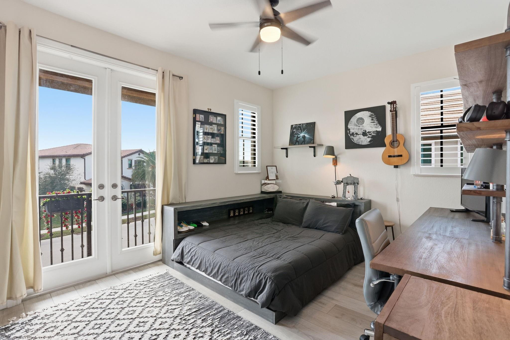 11585 Horizon Road Parkland, FL 33076 - Photo 40 of 91 a spacious bedroom with a bed a couch and a window