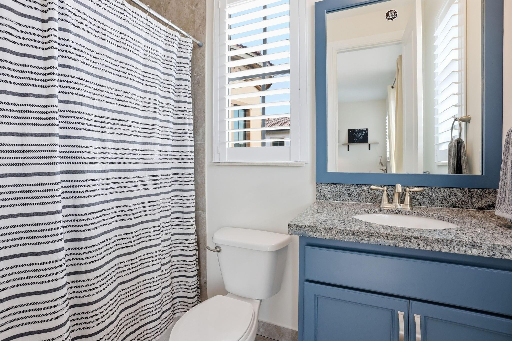 11585 Horizon Road Parkland, FL 33076 - Photo 41 of 91 a bathroom with a granite countertop toilet a sink and a mirror
