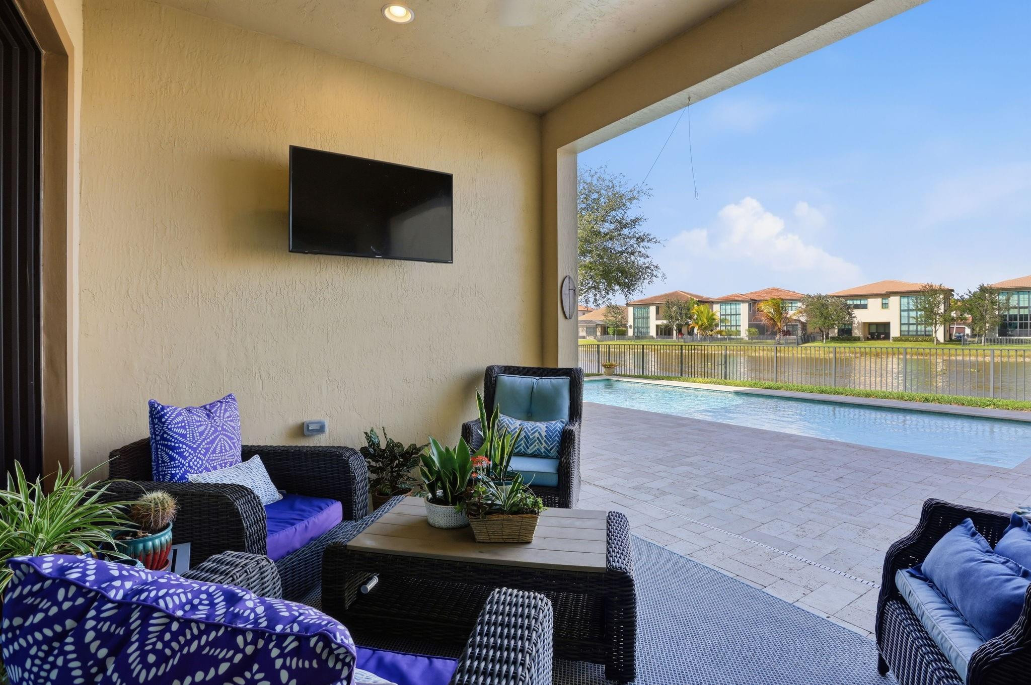 11585 Horizon Road Parkland, FL 33076 - Photo 45 of 91 a living room with furniture and a flat screen tv
