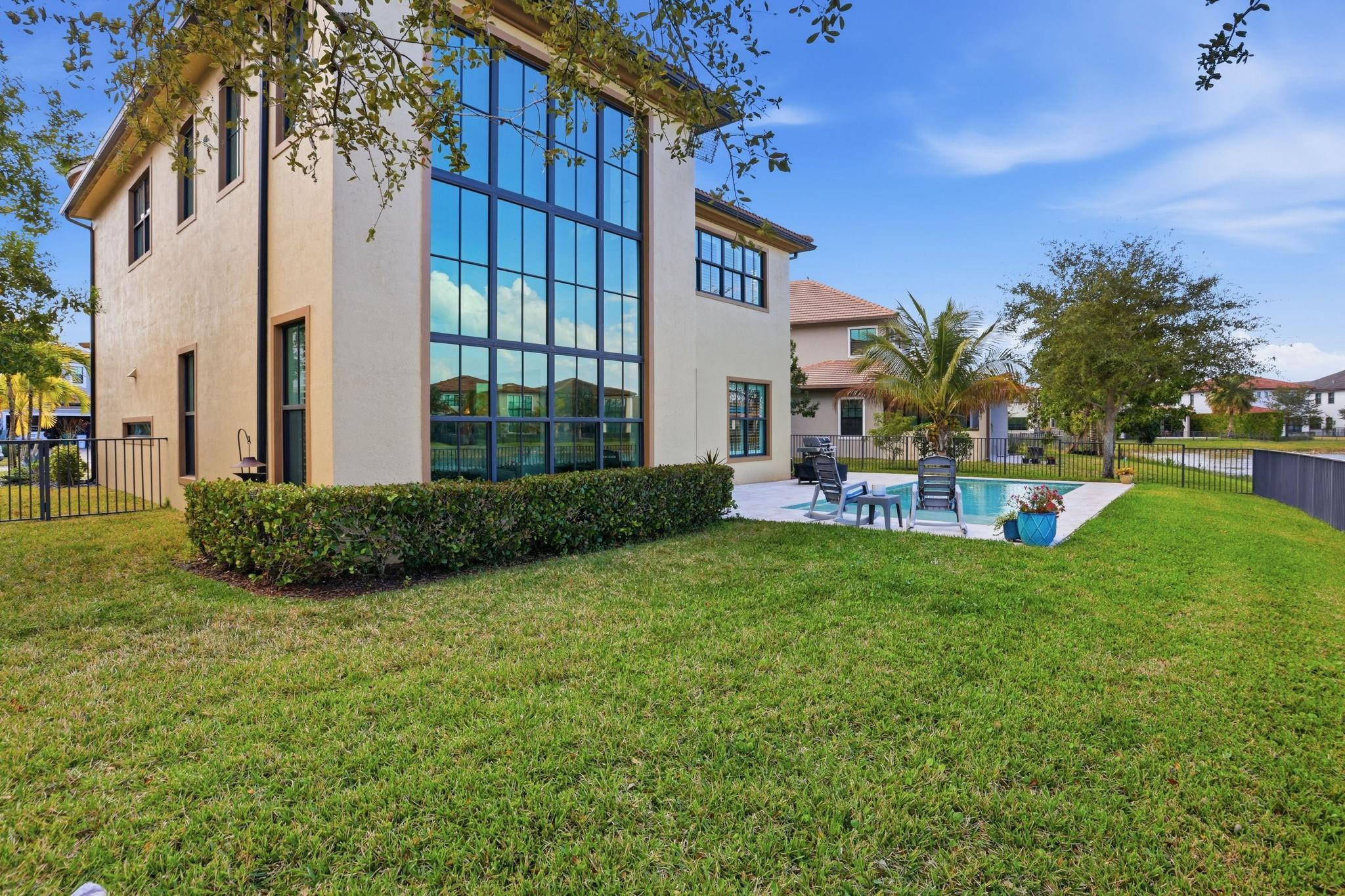 11585 Horizon Road Parkland, FL 33076 - Photo 55 of 91 a view of a house with a backyard