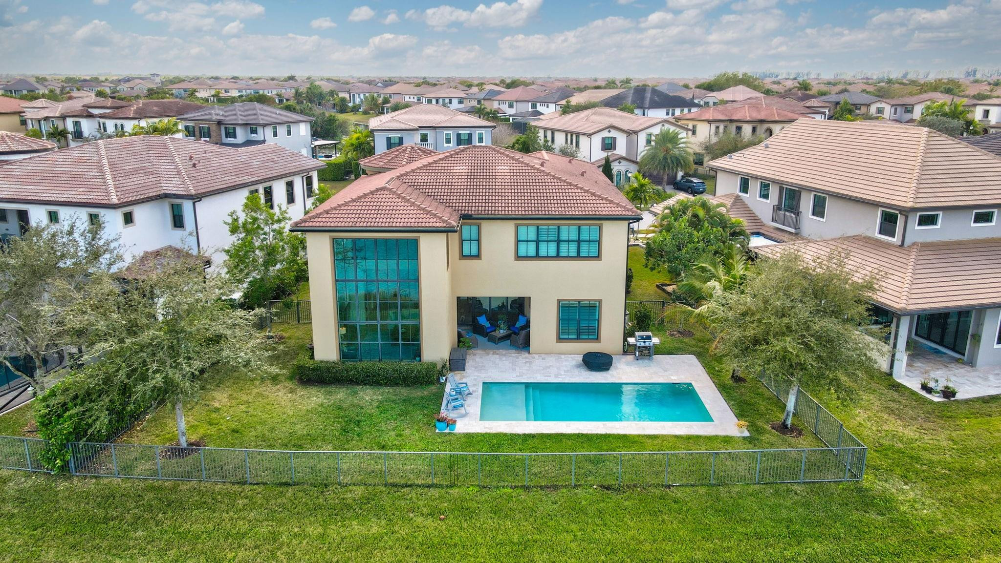 11585 Horizon Road Parkland, FL 33076 - Photo 56 of 91 an aerial view of residential houses with yard and mountain view in front of house