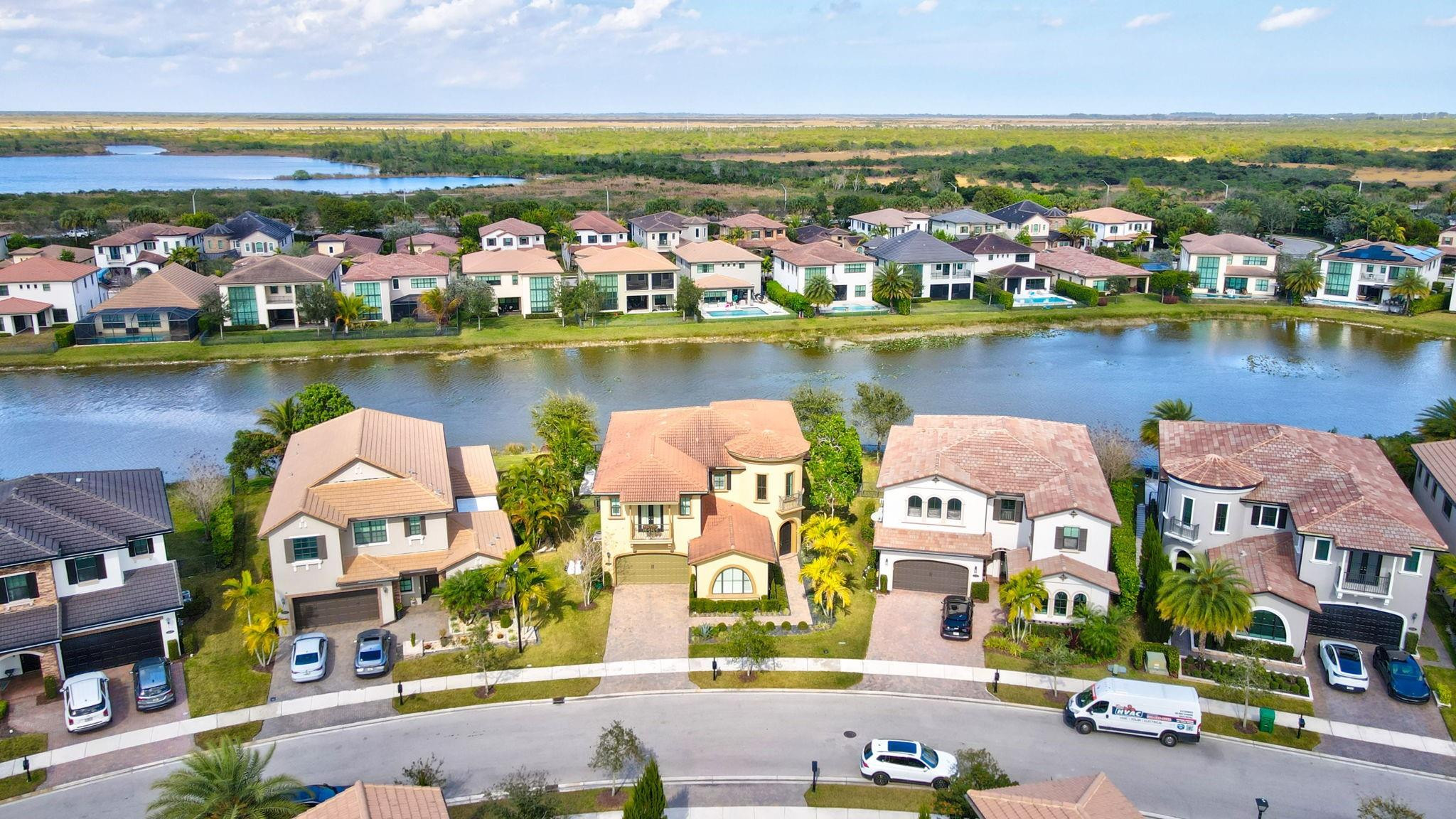 11585 Horizon Road Parkland, FL 33076 - Photo 63 of 91 an aerial view of residential building with outdoor space and lake view