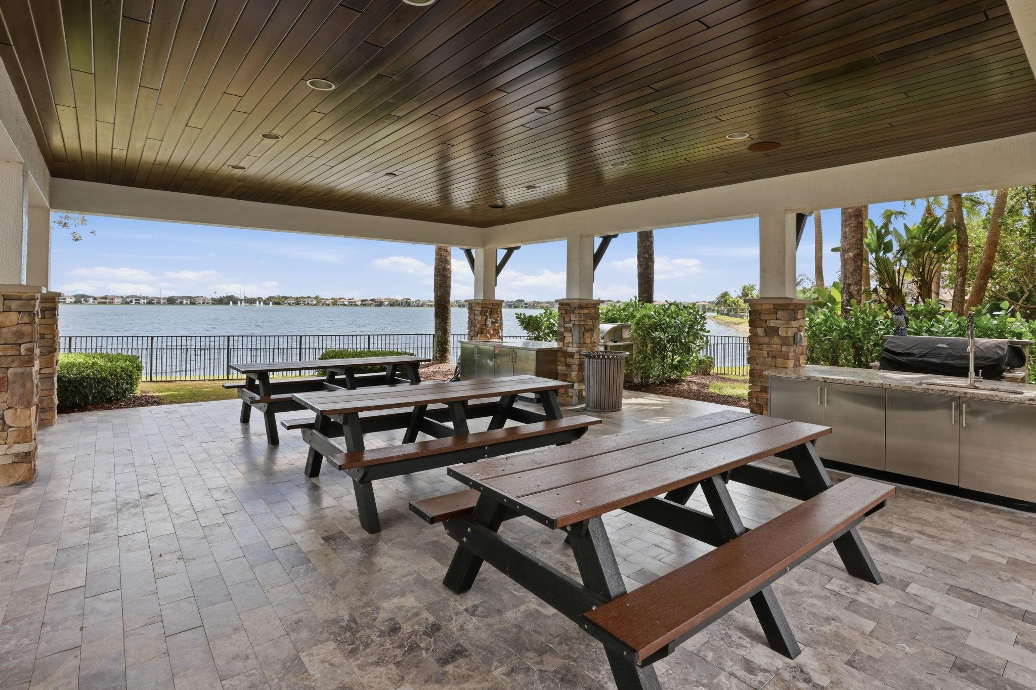 11585 Horizon Road Parkland, FL 33076 - Photo 76 of 91 a view of a patio with a table and chairs