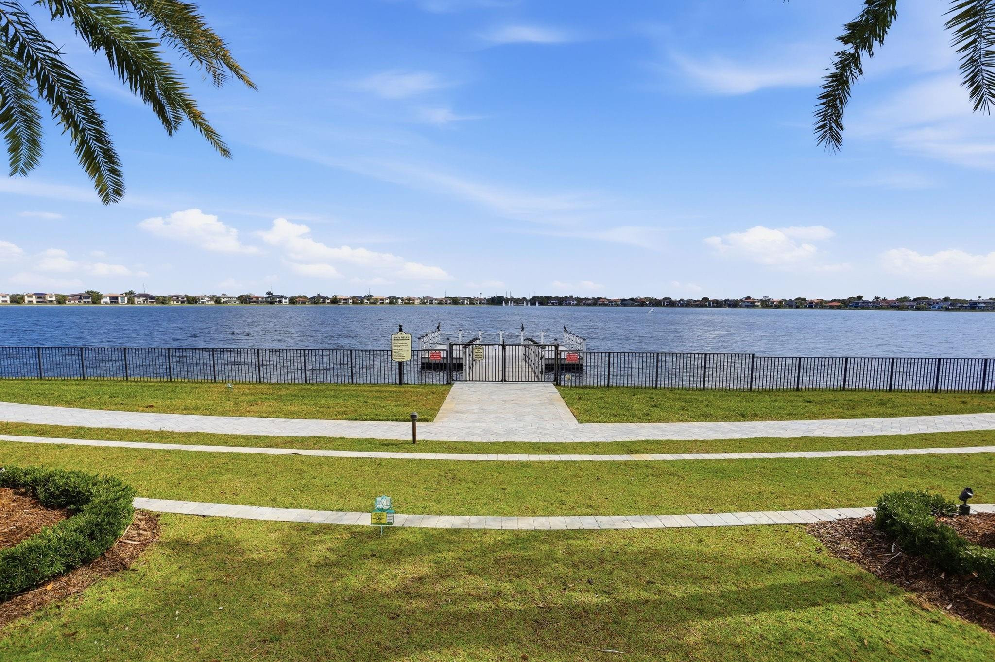 11585 Horizon Road Parkland, FL 33076 - Photo 79 of 91 a view of a swimming pool with a yard and plants