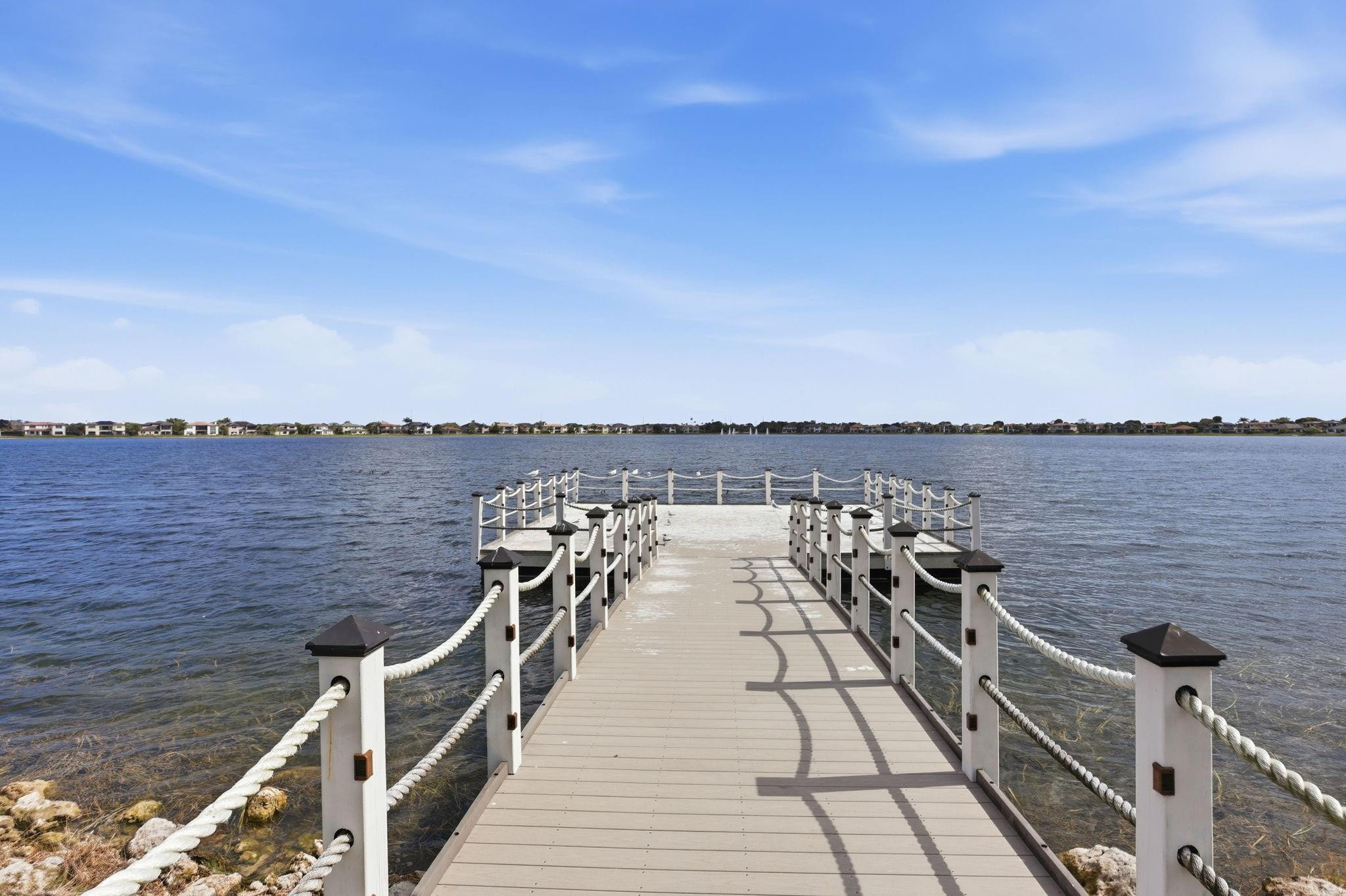 11585 Horizon Road Parkland, FL 33076 - Photo 80 of 91 a view of a terrace with wooden floor and lake view