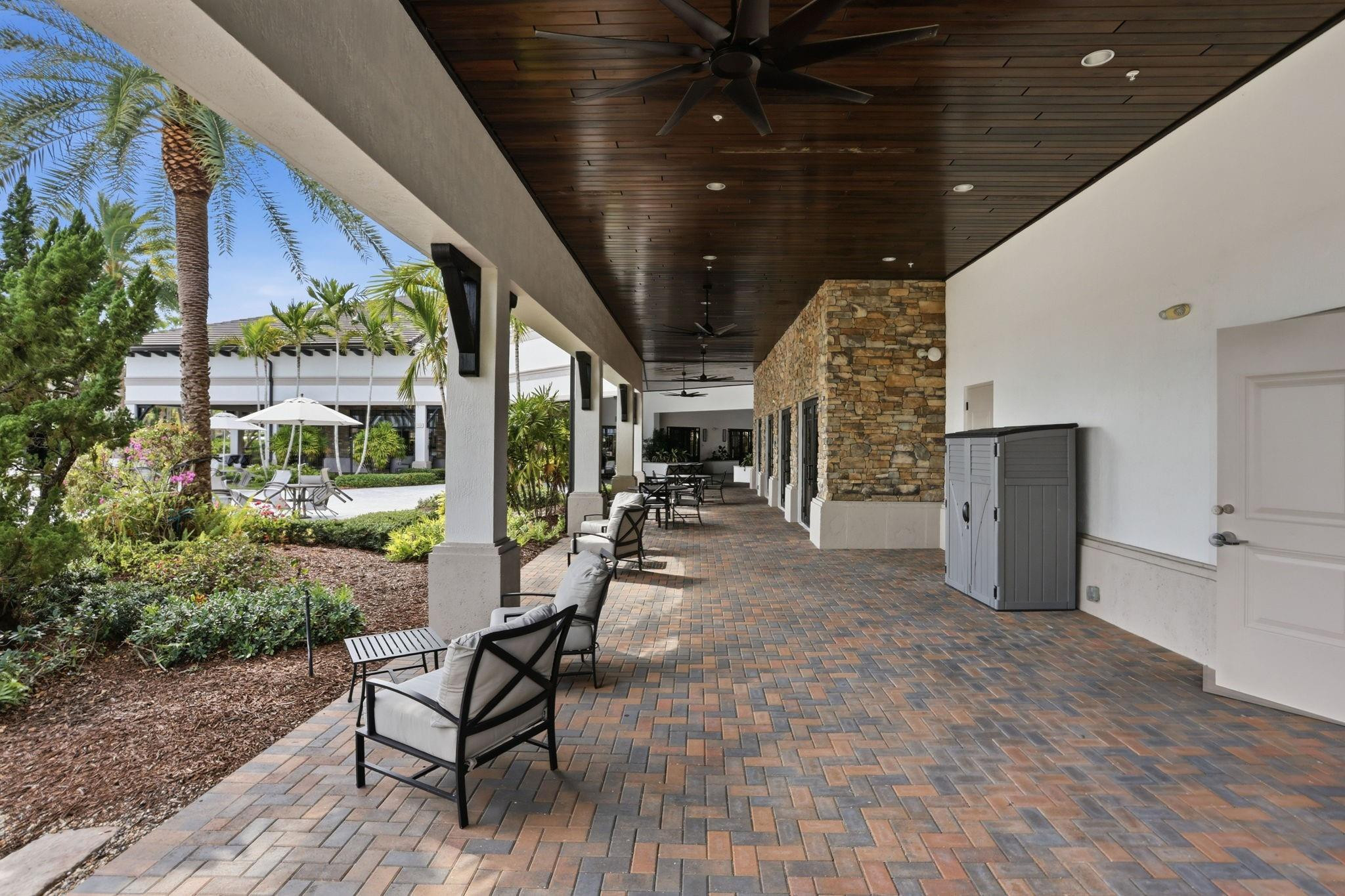 11585 Horizon Road Parkland, FL 33076 - Photo 83 of 91 a building outdoor space with patio furniture and potted plants