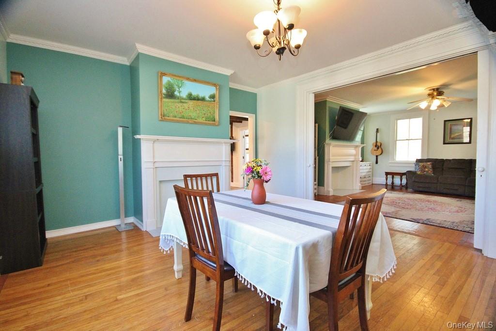 32 Old Glenham Road Beacon, NY 12508 - Photo 19 of 50 a view of a dining room with furniture wooden floor and a chandelier