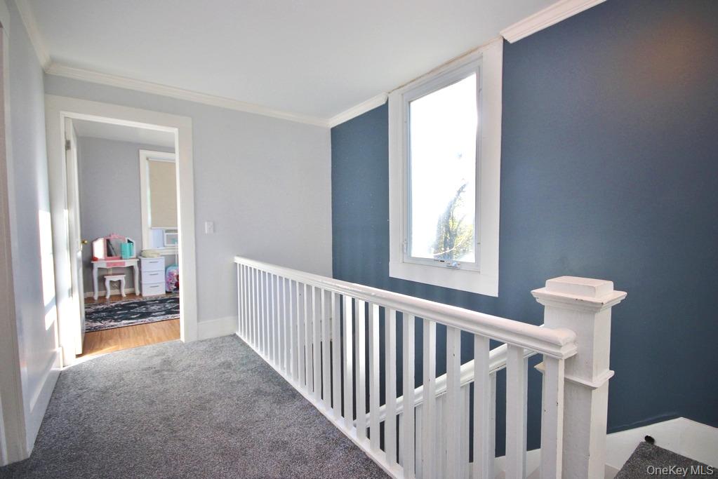 32 Old Glenham Road Beacon, NY 12508 - Photo 21 of 50 a view of a hallway to a livingroom with wooden floor and a window