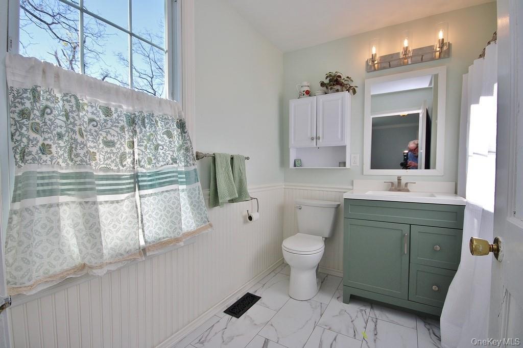32 Old Glenham Road Beacon, NY 12508 - Photo 25 of 50 a bathroom with a toilet sink and mirror