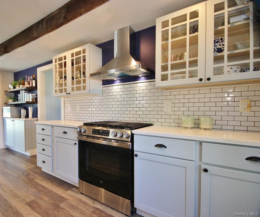 32 Old Glenham Road Beacon, NY 12508 - Photo 3 of 50 a kitchen with a stove and white cabinets