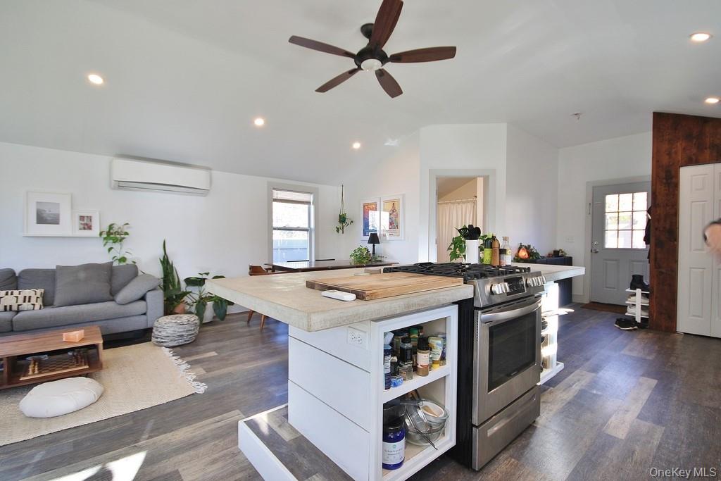 32 Old Glenham Road Beacon, NY 12508 - Photo 38 of 50 a view of kitchen island with stainless steel appliances granite countertop a stove a sink a dining table and chairs