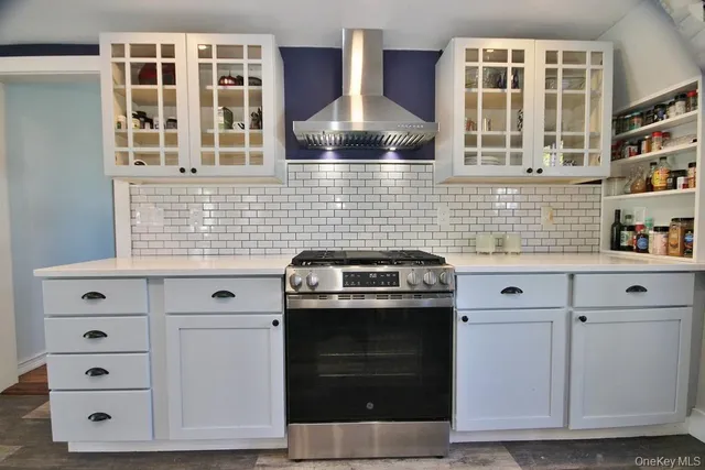 a kitchen with cabinets and white appliances