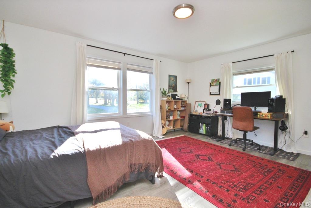 32 Old Glenham Road Beacon, NY 12508 - Photo 43 of 50 a bed room with a bed and a chair