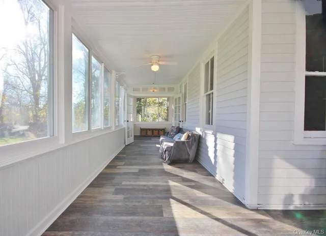 a bed room with a bed and a large window