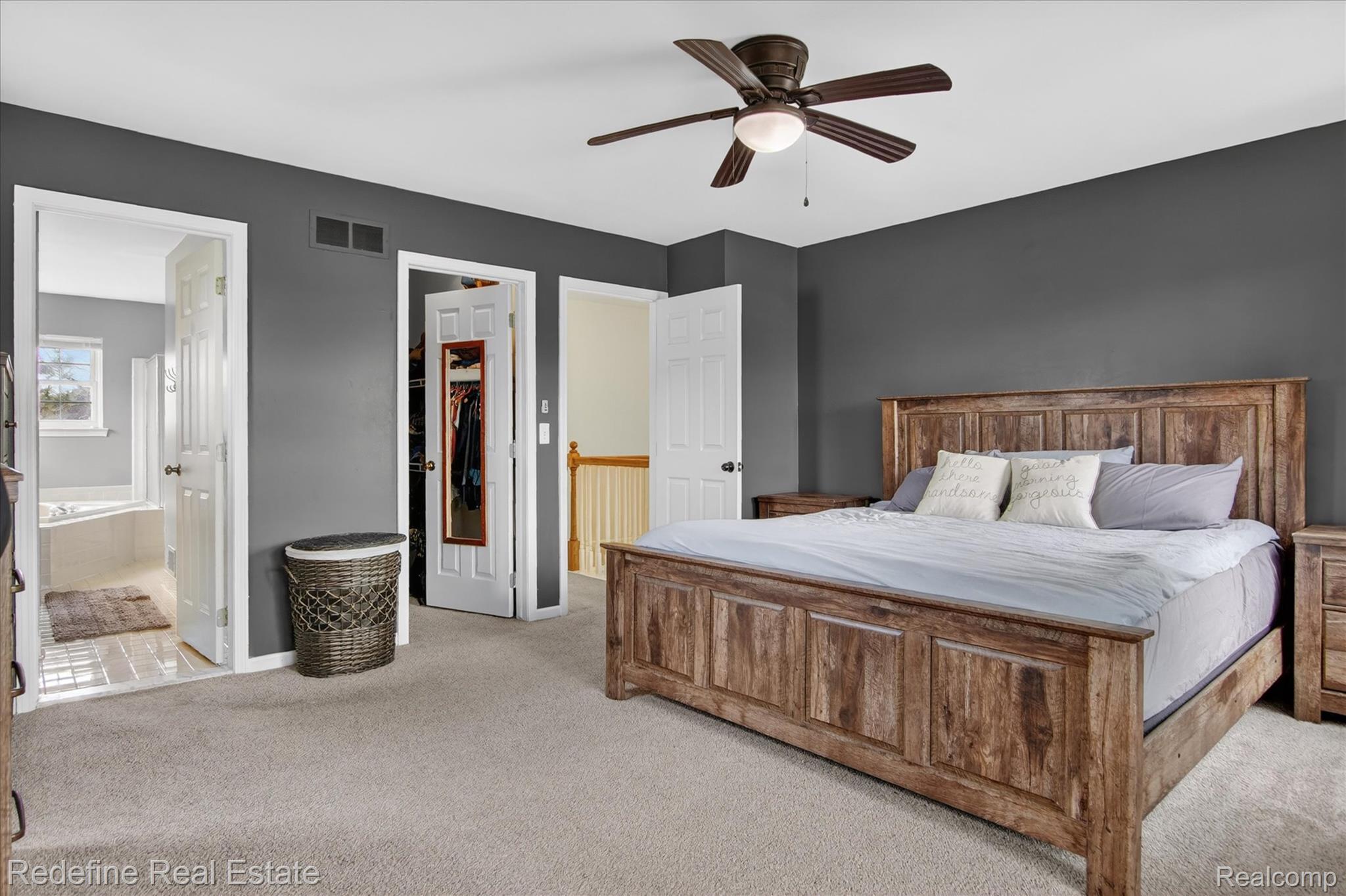 45663 Radnor Road Canton, MI 48187 - Photo 20 of 51 Bedroom with light colored carpet, a spacious closet, a ceiling fan, and connected bathroom