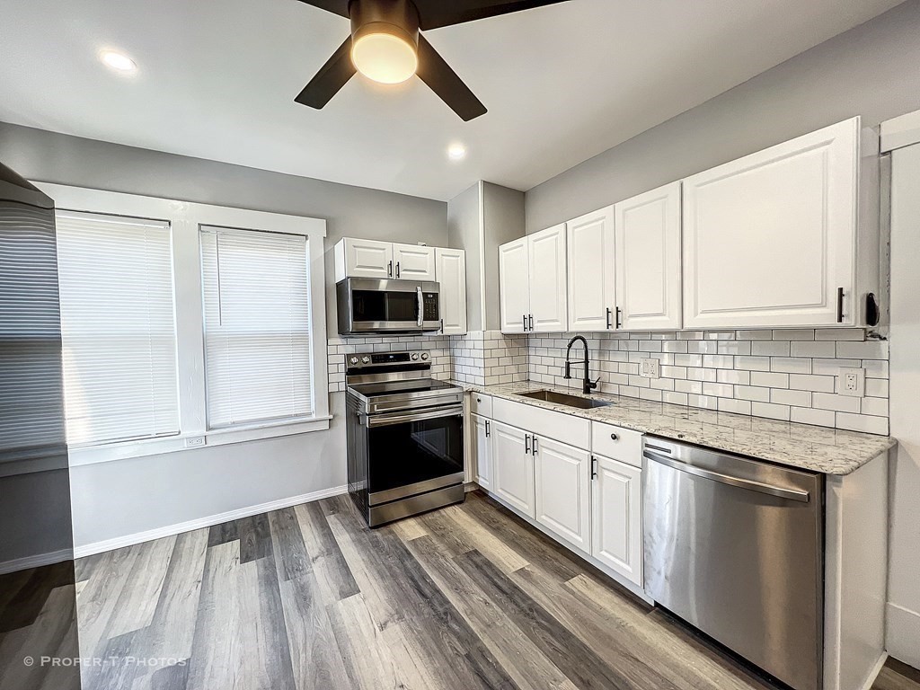 49 Hobson Street Springfield, MA 01109 - Photo 17 of 32 a kitchen with granite countertop stainless steel appliances and sink