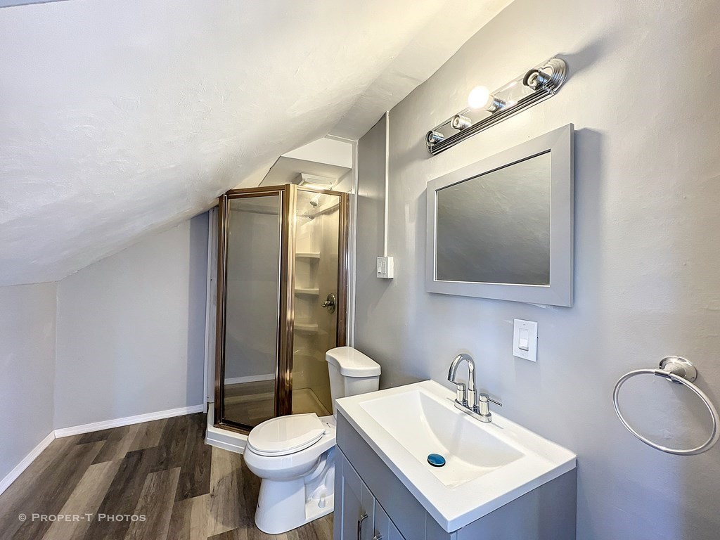 49 Hobson Street Springfield, MA 01109 - Photo 29 of 32 a bathroom with a toilet sink and mirror
