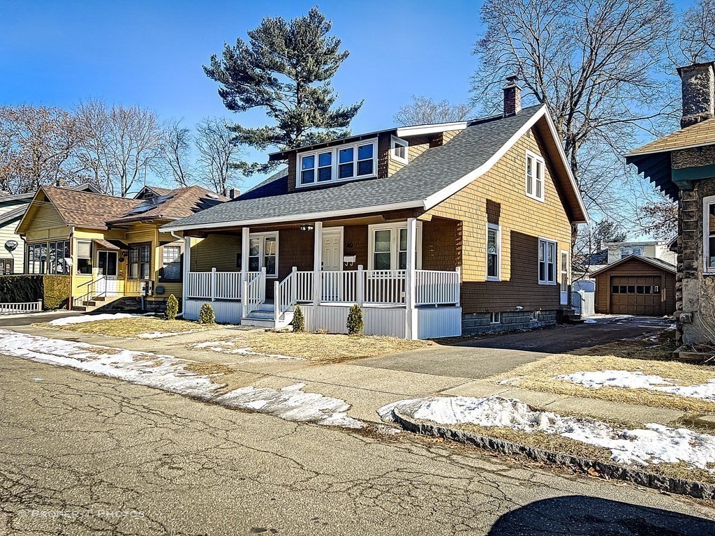 49 Hobson Street Springfield, MA 01109 - Photo 3 of 32 a view of a house with snow on the side of it
