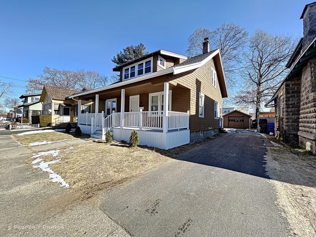 49 Hobson Street Springfield, MA 01109 - Photo 6 of 32 a front view of a house with a yard