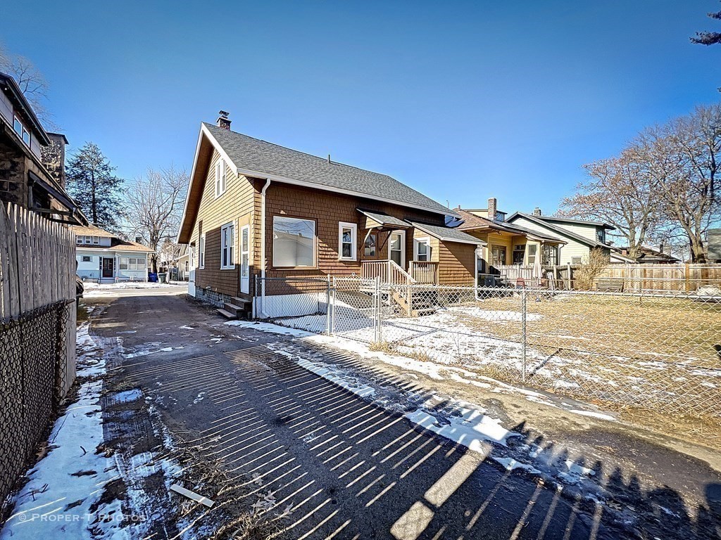 49 Hobson Street Springfield, MA 01109 - Photo 9 of 32 a view of a house with wooden floor next to a yard