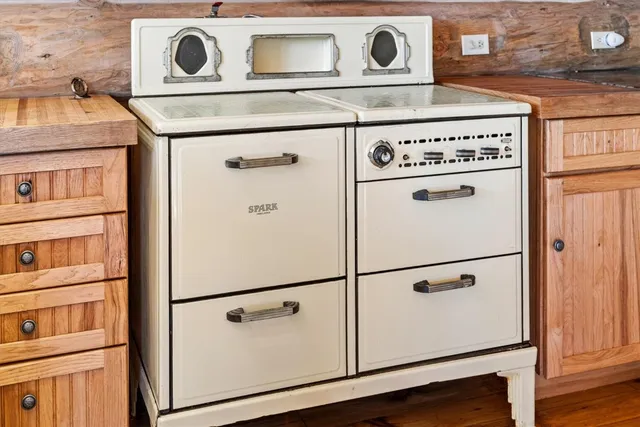 a kitchen with a sink and a stove