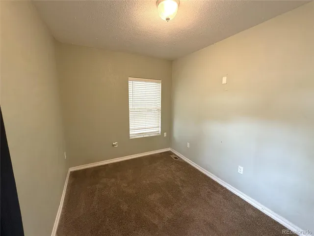 a bathroom with a sink a toilet a mirror and bathtub
