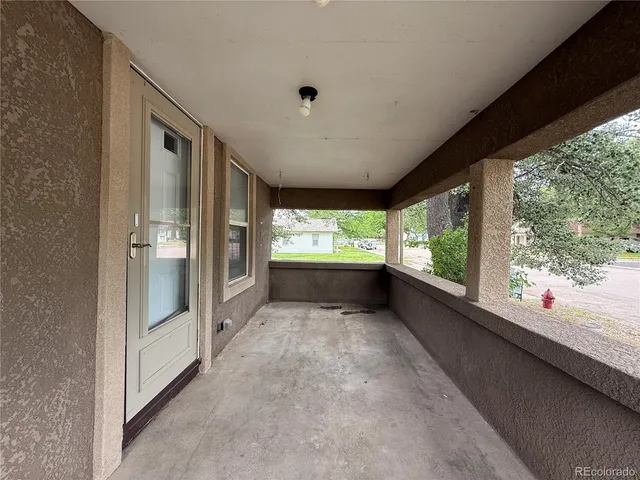 a view of a porch and garden