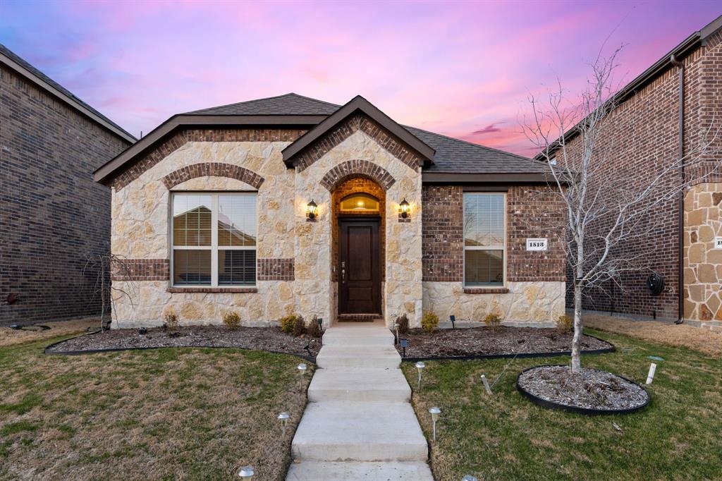 1513 Princeton Drive Celina, TX 75009 - Photo 1 of 1 a front view of a house with garden