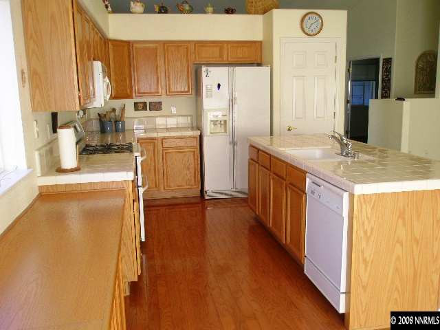 508 Silversmith Place Reno, NV 89511 - Photo 2 of 9 a kitchen with stainless steel appliances a refrigerator and a stove