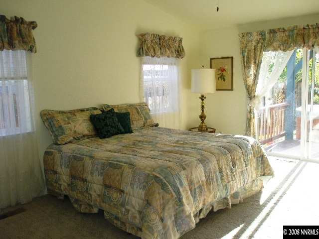 508 Silversmith Place Reno, NV 89511 - Photo 7 of 9 a bedroom with a bed and window