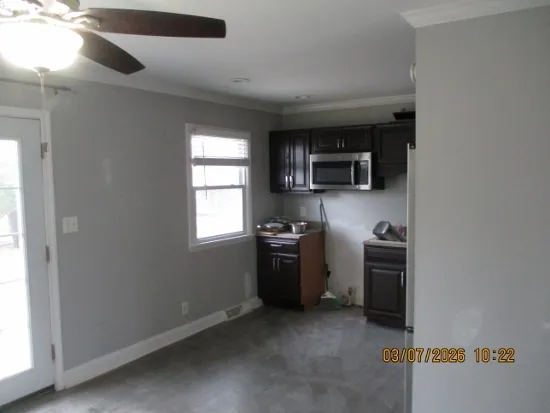 a kitchen with a stove top oven a sink and dishwasher